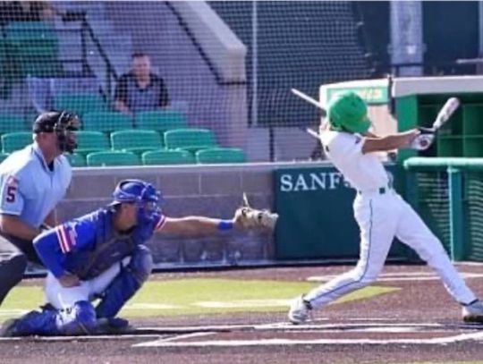 Behind the plate