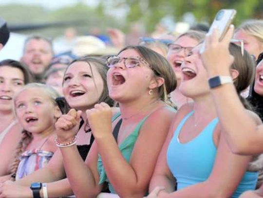 Fans react as Cooper Alan takes the stage for Sunday night's Cedar County Fair entertainment. Huge crowds turned out for all three grandstand performances.