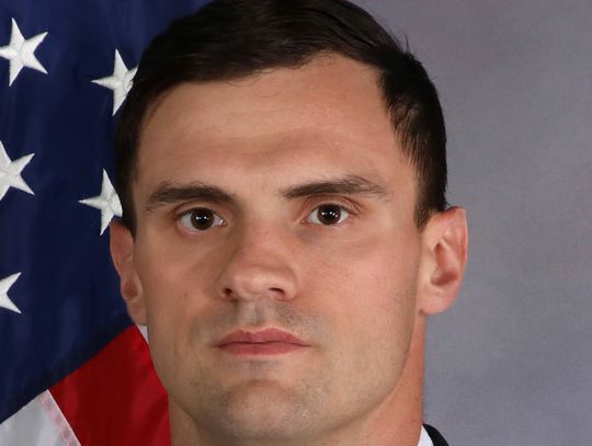 Laurel graduate carries flag during Husker 9/11 tribute