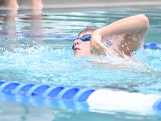 Local swimmers glide past the competition at home meet