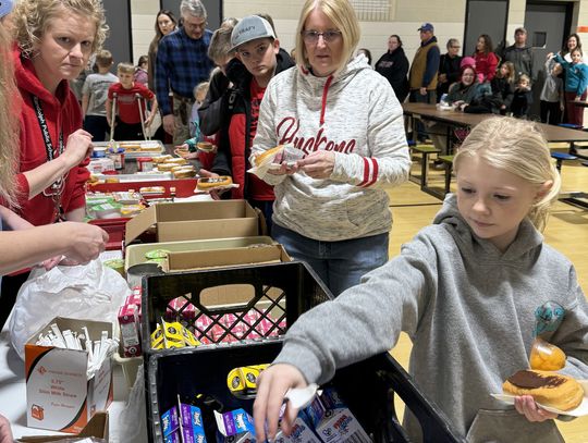 Megan Shearer helps serve