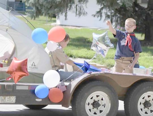 Jeri Schmit|Randolph Times Rex Kizzire promotes Cub Scouts and Boy Scouts during the annual car and tractor parade as part of Randolph’s Community Fair Sunday afternoon.