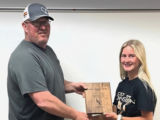 Student Board Member receives plaque