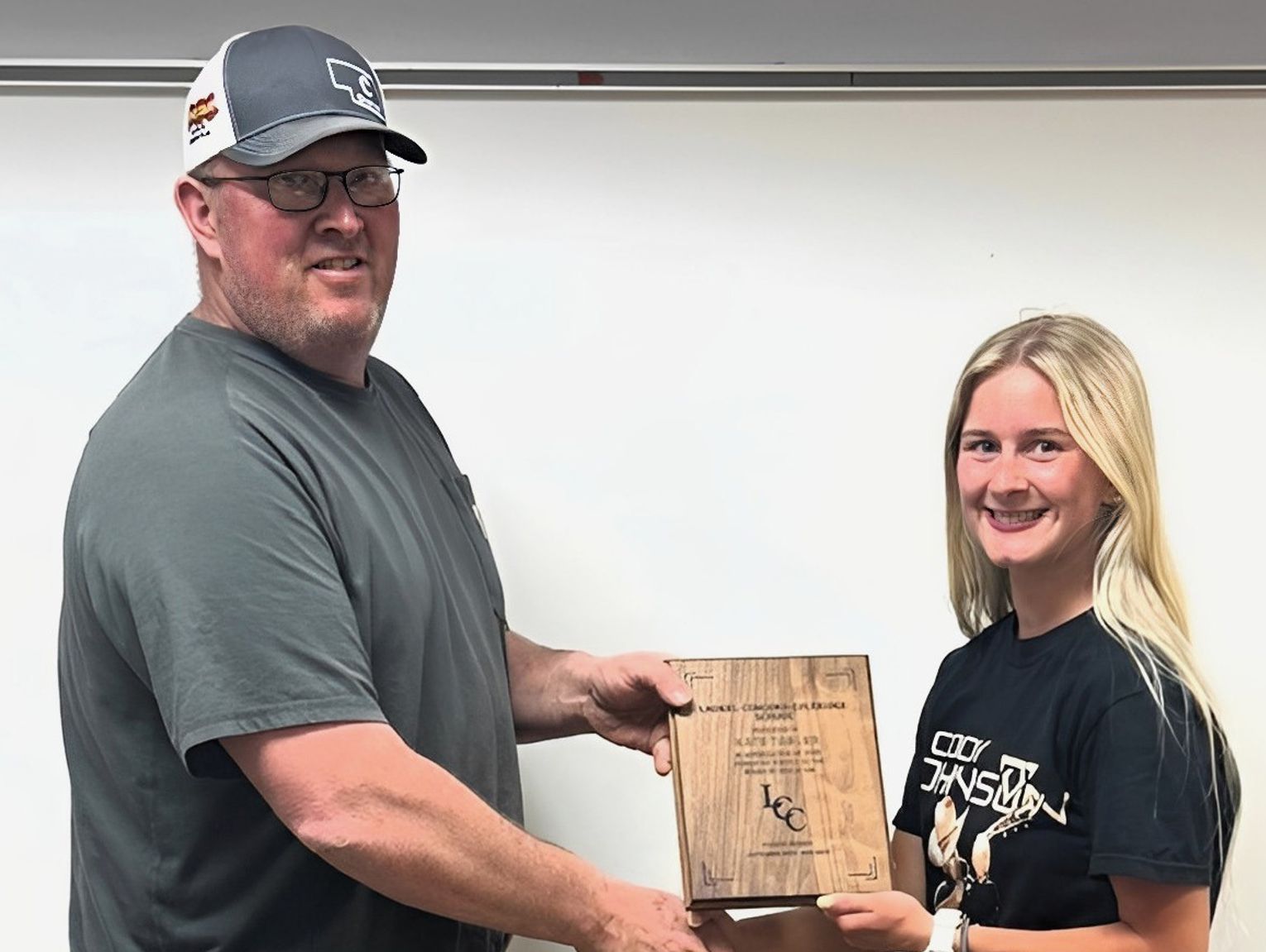 Student Board Member receives plaque