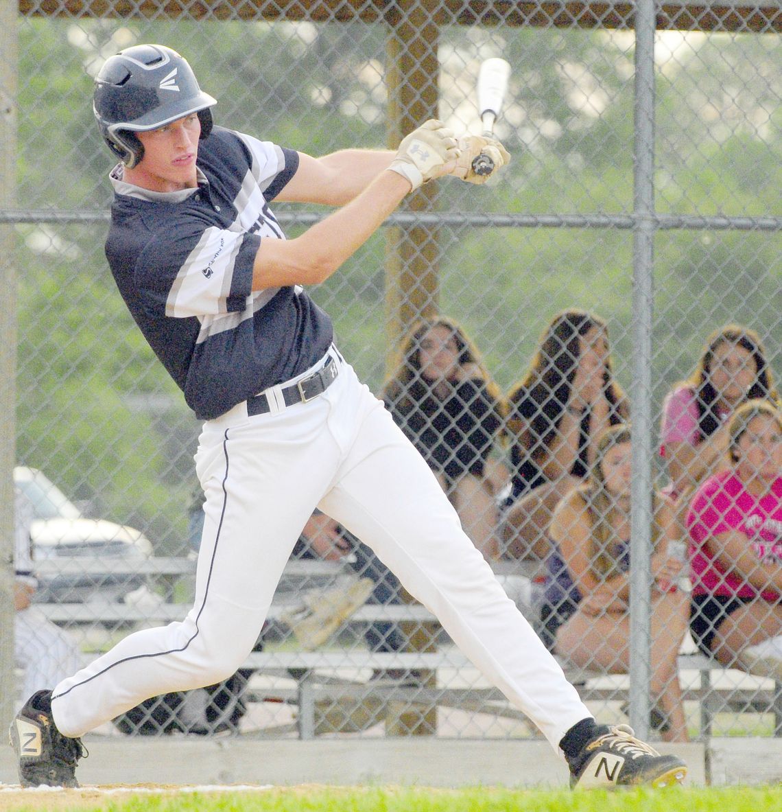 	Hartington Senior Jaxson Bernecker takes a big cut at a fastball during recent action 