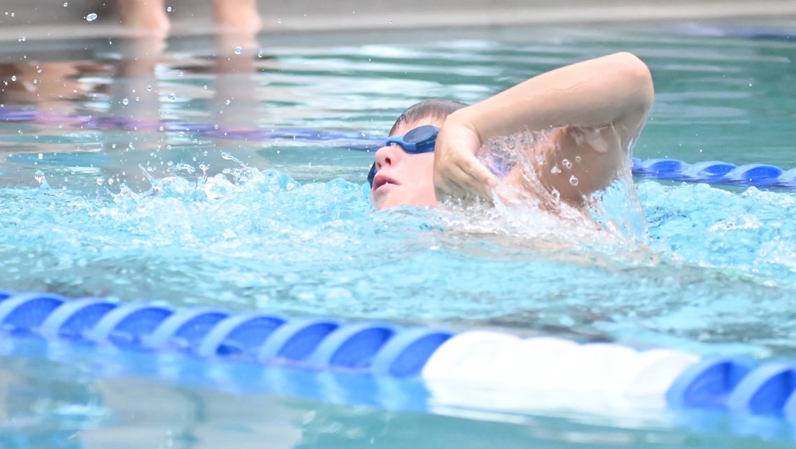 Local swimmers glide past the competition at home meet