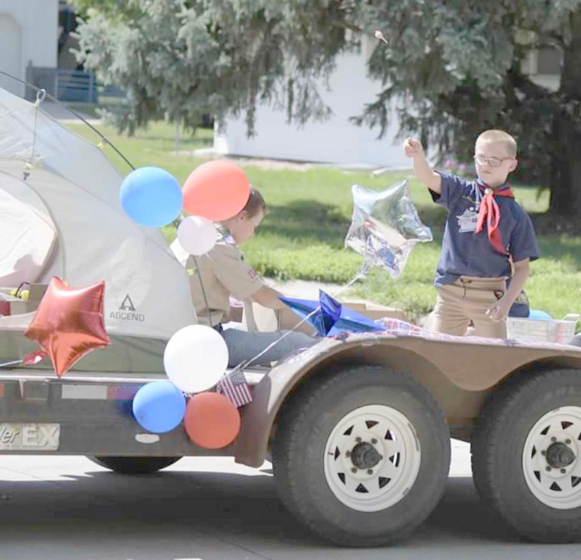 Jeri Schmit|Randolph Times Rex Kizzire promotes Cub Scouts and Boy Scouts during the annual car and tractor parade as part of Randolph’s Community Fair Sunday afternoon.