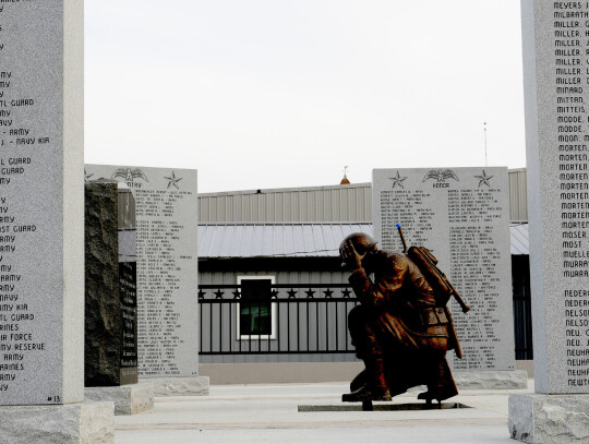 A sculpture of a kneeling soldier to honor fallen comrades is surrounded by granite walls filled with over 1,000 names of Hartington area veterans. Darin Epperly | Cedar County News