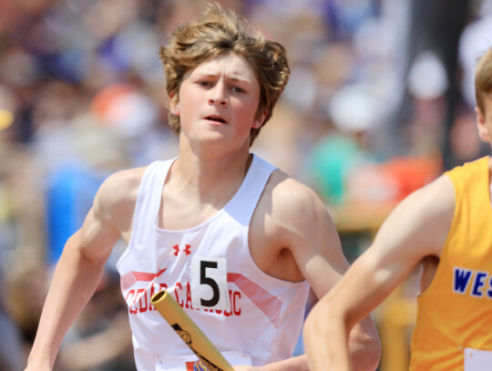 Cedar Catholic’s Mathew Loecker tries to edge ahead of a West Holt opponent during the 4x800 relay at last week’s State track meet. — Cedar County News photos by Jeremy Buss —