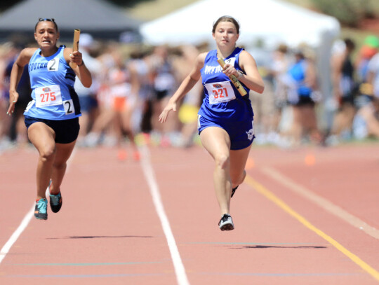 Wynot’s Myrah Sudbeck flies down the main chute at Omaha Burke Stadium during last week’s 4x100 meter relay race. The Lady Devils finished the race in 13t he place.