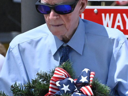 WWII veteran John Grindvold, 103, the oldest living Cedar County veteran, helped lay the wreath at the Memorial.