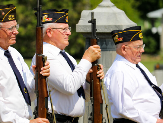 Memorial Day services were held at the Laurel Cemetary, Monday. (Above) Kathy Bradford and Sharyl Luedtke from the American Legion and VFW Auxiliaries place the wreathes for the Unknown Soldier. (Bottom) Regg Ward, Mike Jacobsen and Harry Knudsen prepare 