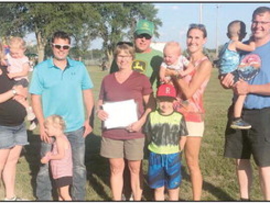 Mark and Kathie Nordhues (middle) received the Farm Family of the Year Award. The family includes Courtney and Andy, Adalyn and Alivia; Britni, Matt, Owen, Callen and Clare. Trisha Benton|Randolph Times