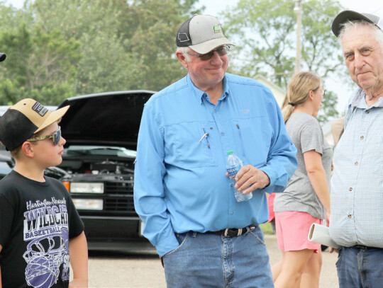 Monte Hefner and his grandson, Craig Ebberson and Ron Stapelman take a moment to talk during the car and tractor show held in conjunction with Belden’s 100th Birthday Bash on Saturday afternoon. Sandra Cross | Laurel Advocate