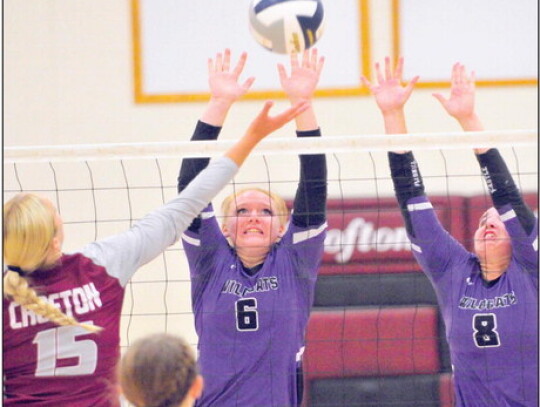 Zoey Gratzfield and Lauren Howell of Hartington-Newcastle defend as Jaisie Janssen of Crofton tips the ball over during season-opening volleyball action Thursday night in Crofton. Darin Epperly | Cedar County News