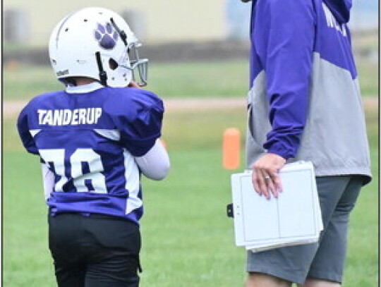 Coach Nathan Koch gives Sawyer Tanderup some last-minute instructions before sending him into Sunday afternoon’s game against Homer. Rob Dump | Cedar County News