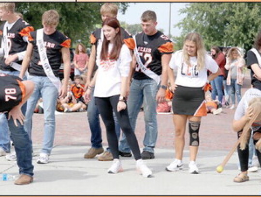 Aric Hall and Haley Hart participating in a game during the pep rally Friday downtown.