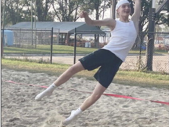 Homecoming kickoff festivities included a sand volleyball tournament that pitted the boys against the girls in each respective class. Each team also chose a theme in which to dress for the games. Freshman Ryan Engel (photo at left) gets sideways going aft