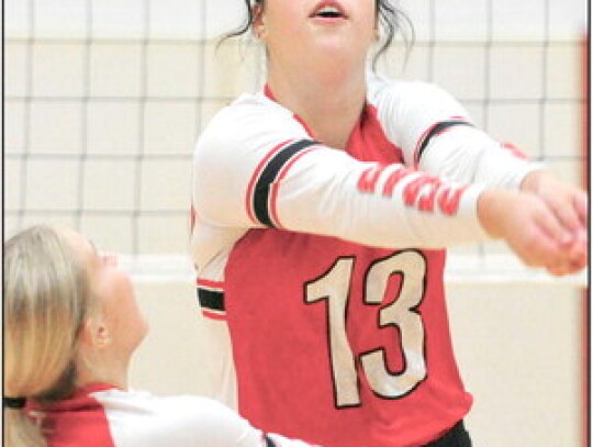 Cedar Catholic’s Addison Walter digs the ball as teammate Bailey Hochstein (left) backs her up during volleyball action against Elgin Public-Pope John at Norfolk Catholic High School last Tuesday night. Darin Epperly | Cedar County News