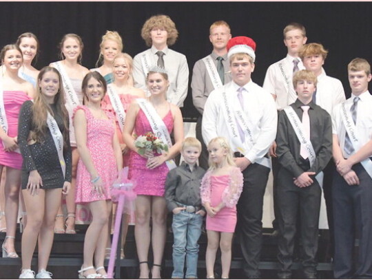 Kynlee Winkelbauer and Nicole Haselhorst rev up the crowd during Friday’s Homecoming football game. The royal court pose for a picture after coronation inuding: (back row) Delayne Thelen, Eva Bermel, Jocilyn Griner, Brayden Shearer, Jake Harder, Brandon