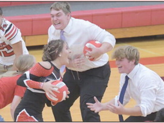 Brynn Janssen cheers during Friday’s pep rally. Due to weather, the rally was moved indoors. In the photo below, Bryson Eledge, Aiden Gubbels and Joe Millerparticipate in a game during Friday’s pep rally. In the photo at far left, Jake Harder, Justin 