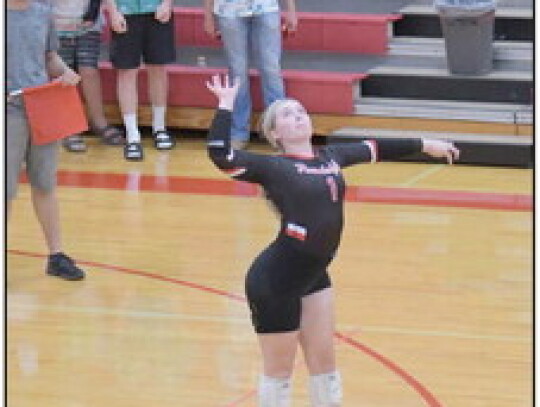 Rylee Thelen (photo above) tips the ball over the net in action against Walthill. The squad (2-12) played host to a triangular that saw them beat Walthill (25-15, 25-17) and drop a 2-0 (25-6, 2514) decision to Wakefield. Ella Scott (photo at right) arches