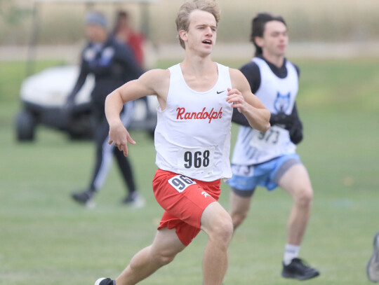 Justin Guenther gets off to a fast start in the boys 3,000-meter run at the Cross Country Conference meet Friday. Guenther finished in 19:33. Matthew Schultz (top right) gets the edge over an Osmond runner during the conference meet. Brayden Shearer (righ