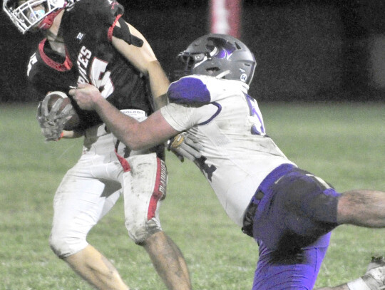 The Wildcats’ Ayden Rosener tackles Spencer Hille of Plainview during playoff football action Friday night in Plainview. Darin Epperly | Cedar County News