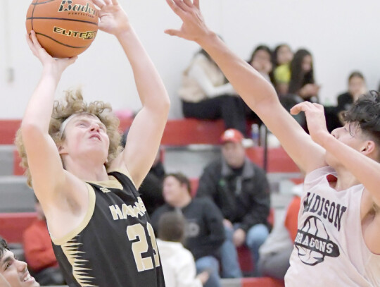 Jeri Schmit|Randolph Times Senior Brayden Shearer puts a shot up against Madison in the Jamboree game last week. The Hawks season opener will take place in Osmond Thursday, Nov. 30 against O’Neill St. Mary’s.