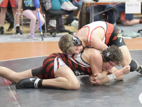 Gage Jensen gets into position while wrestling an opponent at the Stanton Invitational Saturday. Seven wrestlers brought home medals including Jensen with a third-place finish in the 190-pound division. Jeri Schmit| Randolph Times