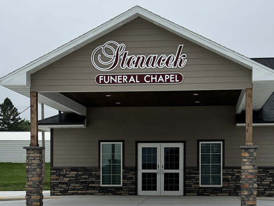 Gov. Jim Pillen (left) fields questions from the audience during his visit to Randolph in September. The meeting was held at the new Stonacek Fueneral Chapel (right. The new building changed the Highway 20 landscape in 2023. Trisha Benton| Randolph Times