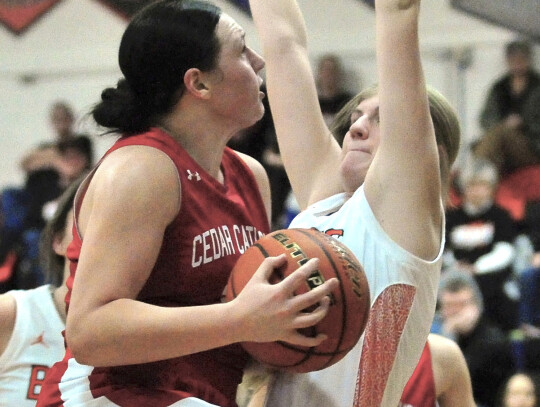 Cedar Catholic’s Addison Walter drives in for a layup as LCC tries to defend during action in Laurel last week. Walter’s 16 points paced the Cedar offense to the 63-49 win. Darin Epperly | Cedar County News