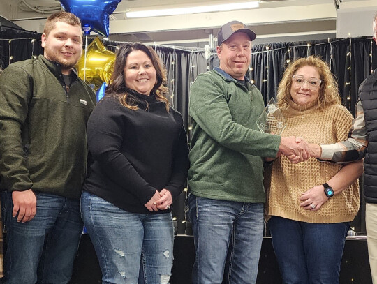 Staff and family members of Hansen Brothers, Laurel, accept the 2023 Agribusiness of the Year Award during the Laurel Chamber Community &amp; Agribusiness Appreciation Banquet Sunday night including Morgan and Ben Barelman, Hillary Kuhlman, Steve and Lisa