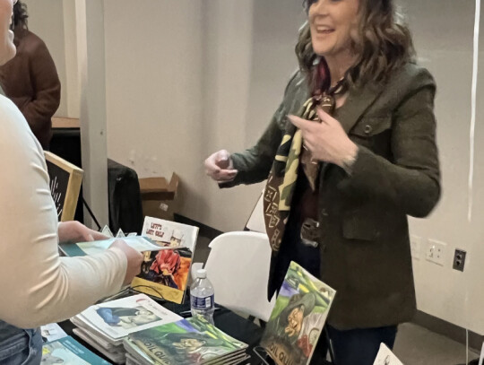 Amanda Radke talks one-on-one from her booth at the Laurel Chamber Community &amp; Agribusiness Appreciation Banquet Sunday night. She was the featured speaker and also sold her children’s books at the event. Trisha Benton|Laurel Advocate