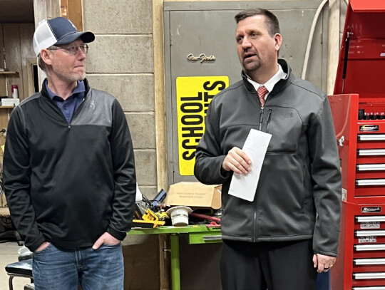 Anson Dockhorn and Superintendent Daryl Schrunk discuss facility needs at the Randolph school district’s bus barn. “The current facility is in need of some serious repairs, but it’s also not really meeting the needs of the district,” said Michael 