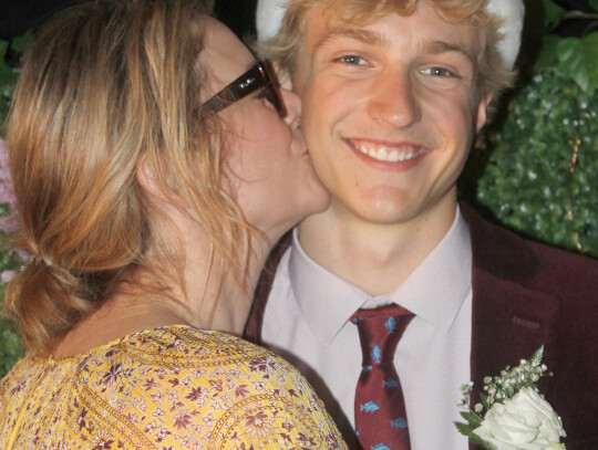 Erin Schroeder congratulates her son Chase with a kiss after he is crowned as Wynot’s Prom King.