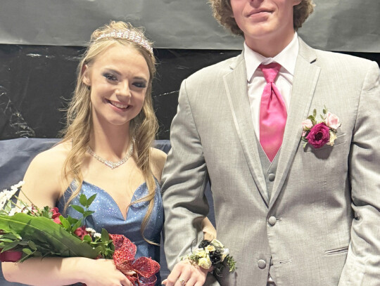 Prom Queen Emilee Olson poses with Prom King Brayden Shearer after being crowned. Kora Winkelbauer and Jake Harder (left) pose during Grand March. Rylee Thelen (top right) waits patiently as Kim Nordhues of Shear Image works her hair magic. Ella Scott and