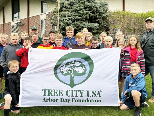 Members of the Holy Trinity fourth grade class helped Hartington Tree Board chairman Dan Kathol plant a tree last week for Arbor Day. (Back): Archer Thoene, Emmet Fischer, Chance Bensen, Dan Kathol, Tyler Gubbels, Henry Holloway, Eli Cattau, Halle Backer,