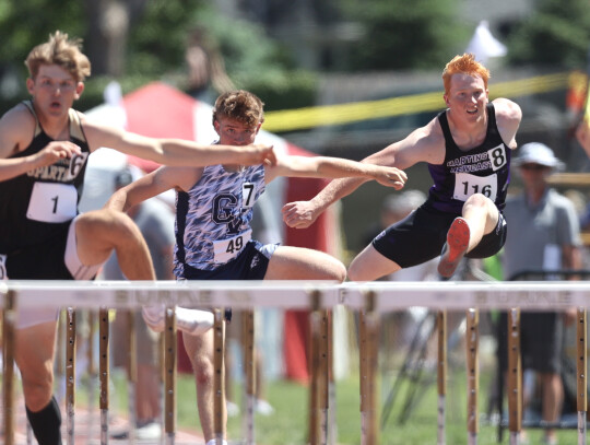 Hartington-Newcastle’s Kale Korth leaps over the hurdles during his State Track Meet preliminary round race. Jeremy Buss | Cedar County News