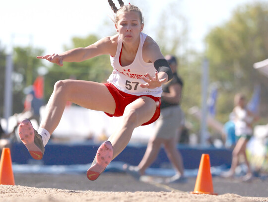 Cedar Catholic’s Anisten Wortmann flies through the air on her long jump attempt at last week’s State Track Meet. The Cedar freshman earned a sixth-place medal in the long jump. Jeremy Buss | Cedar County News