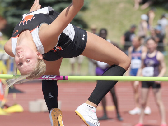 Laurel-Concord-Coleridge’s Tali Erwin slips over the bar during the State high jump competition last week in Omaha. Jeremy Buss | Laurel Advocate