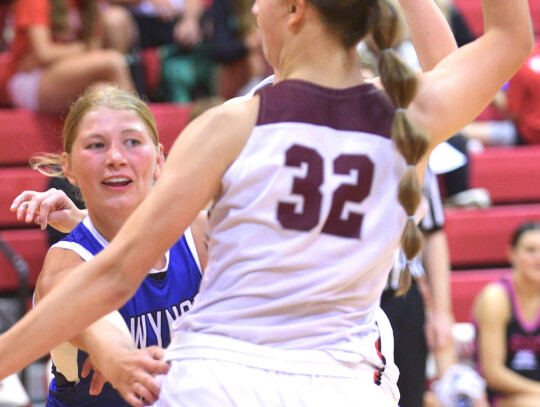 Wynot’s Kinslee Heimes of the girls’ Dark Team passes the ball off during the Northeast Nebraska All-Star basketball game on Friday night. Darin Epperly | Cedar County News