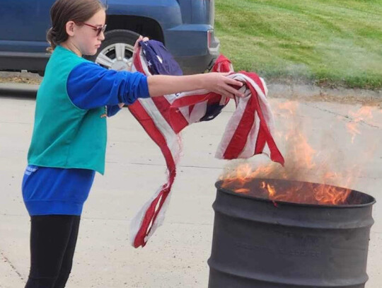 Courtesy Photo Members of the local VFW and American Legion organizations hosted a flag burning ceremony at Randolph Area Veterans Memorial Park Friday which was Flag Day. A number of youth in scouting helped properly dispose of flags during the ceremony 