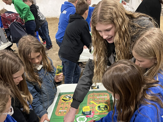 Ava Stewart, Newcastle, (bottom) facilitates the Ag Innovators to thired/fourth grade youth from Wynot Public Schools at the Life on the Farm Festival.