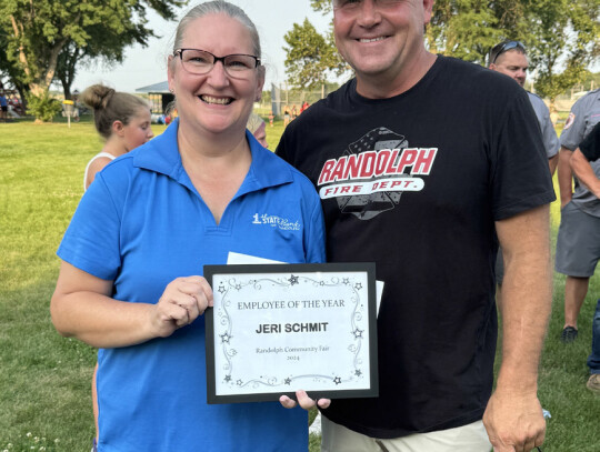 Jackie Loberg|for the Randolph Times Last year’s Queen Bee Sandra Kuhlman crowns Julie Loberg as the 2024 Queen Bee to kick off Community Fair activities Friday night. Loberg’s nomination included anecdotes about her positive attitude while working as